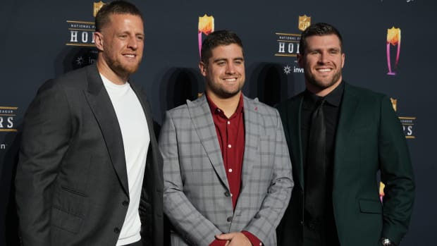 J.J. Watt, Derek Watt and T.J. Watt pose for the cameras at the red carpet for the NFL Honors ceremony.